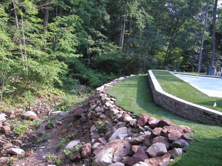 Excavated rocks were used to create this very strong retaining wall