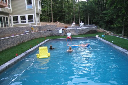 The family can enjoy the pool while the landscaping proceeds